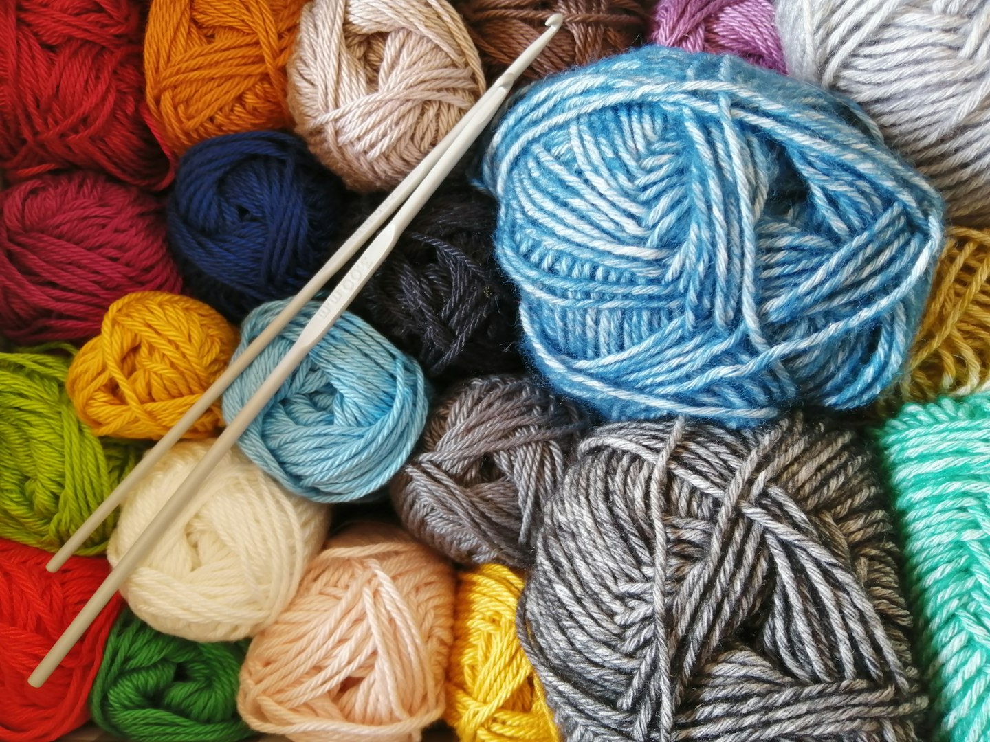 Crochet club. Elderly women knitting together in a workshop.